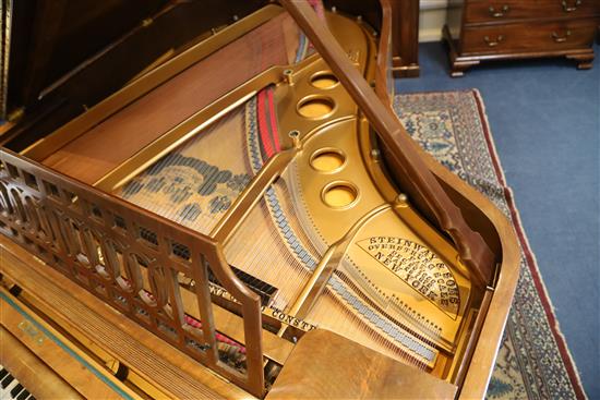 A Steinway & Sons figured walnut boudoir grand piano, W.4ft 8in. L.5ft 10in.